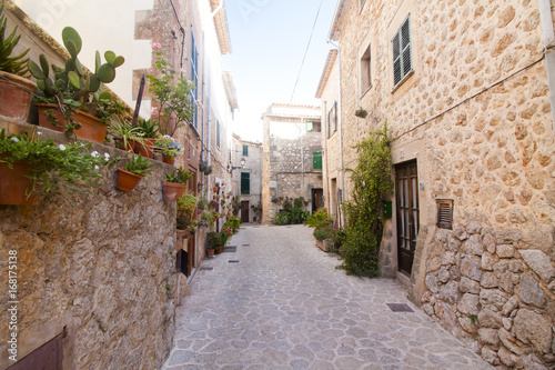 Fototapeta Naklejka Na Ścianę i Meble -  Beautiful street in Valldemossa, famous old mediterranean village of Majorca Spain.