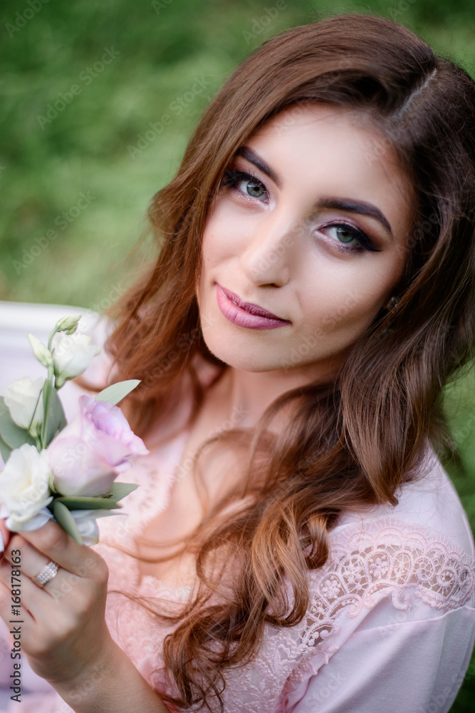 Look from above at woman with white roses in her arms Look from above at woman with white roses in her arms