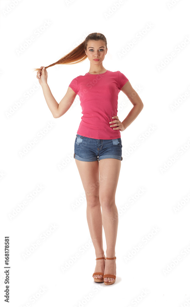 Girl in a T-shirt and shorts on a white background