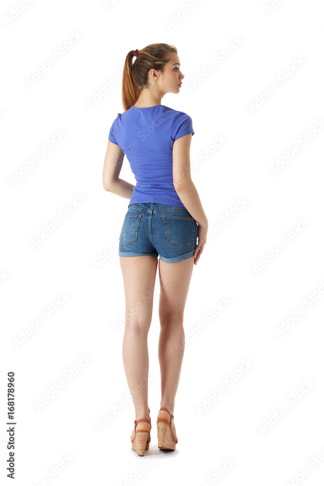 Girl in a T-shirt and shorts on a white background Girl in a T-shirt and shorts on a white background