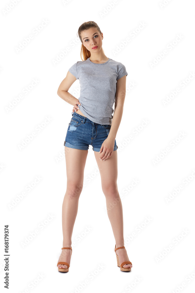 Girl in a T-shirt and shorts on a white background Girl in a T-shirt and shorts on a white background
