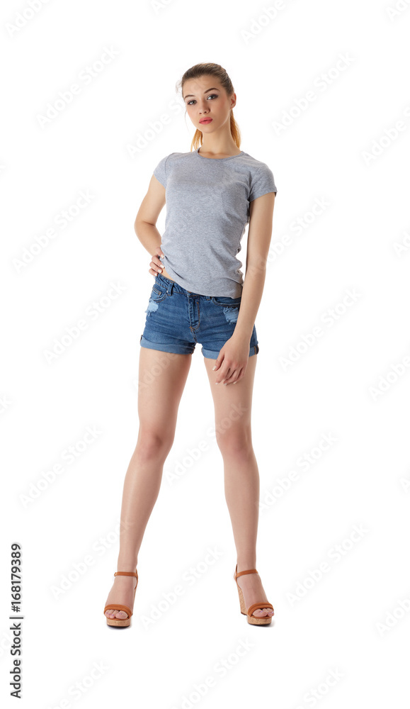 Girl in a T-shirt and shorts on a white background Girl in a T-shirt and shorts on a white background