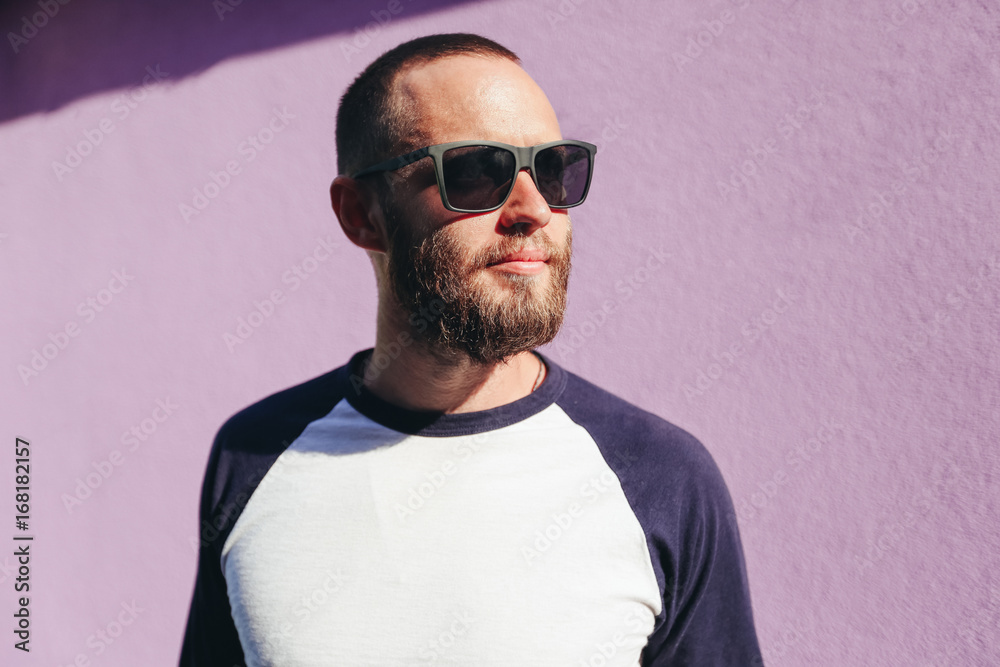 Fototapeta premium Hipster man wearing black sunglasses in urban city streets