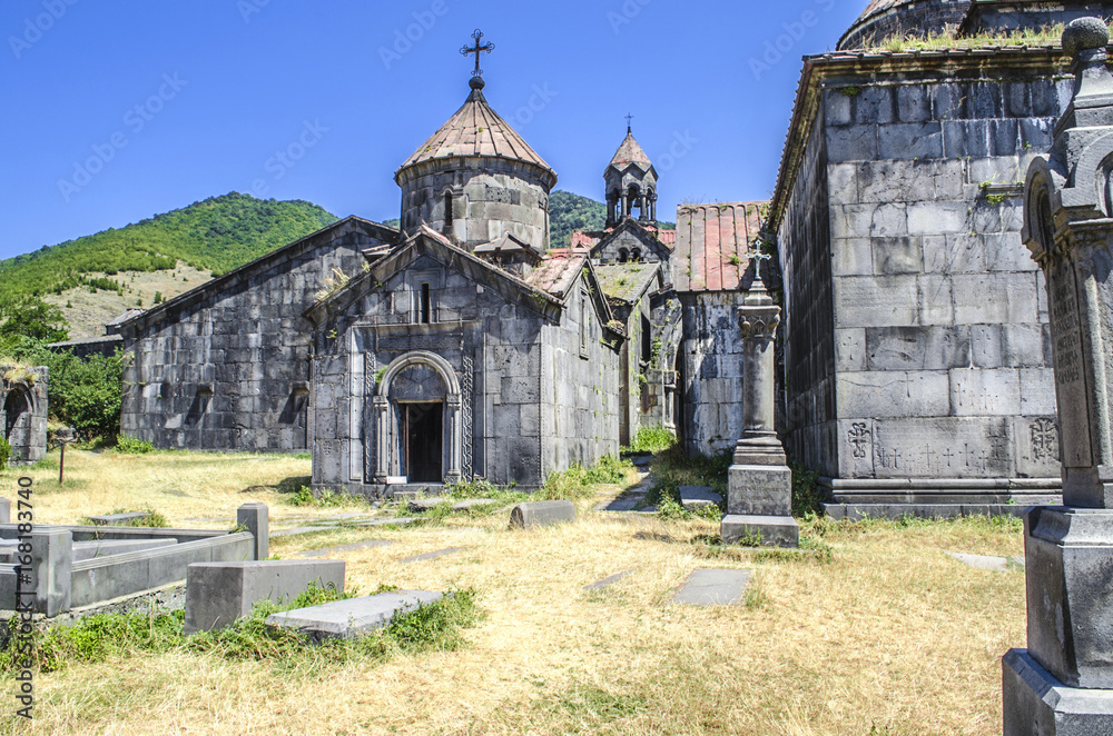 Naklejka premium Church of the Blessed Virgin and a view of the three-nave bell tower on the territory of the monastery of Haghpat 