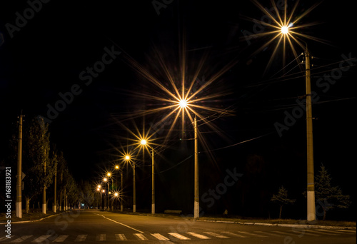 Light stands and flare beside the road in evening time