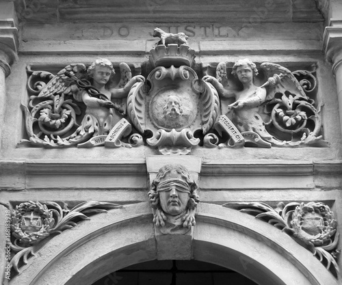 carvings on the entrance above the door of halifax town hall a former court with emblems and a figure of justice photo