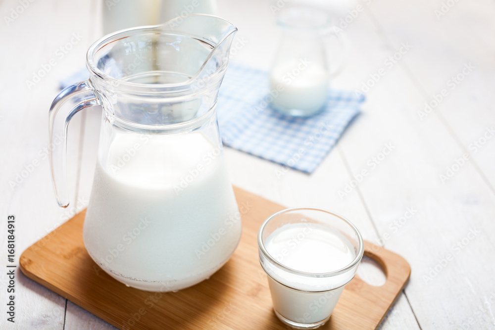 milk and glasses of milk on a wooden rustic table. milk and glasses of milk on a wooden rustic table.