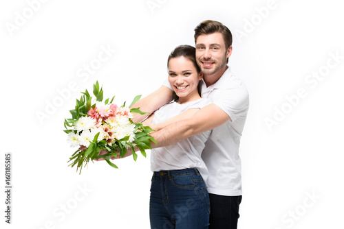 couple with bouquet of flowers