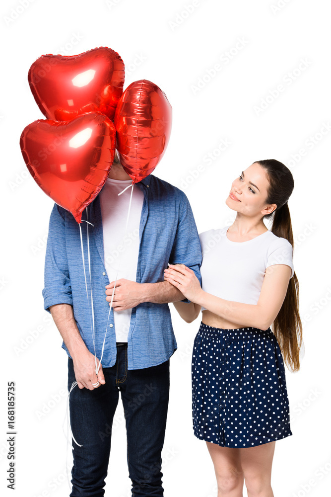 couple with heart shaped balloons couple with heart shaped balloons
