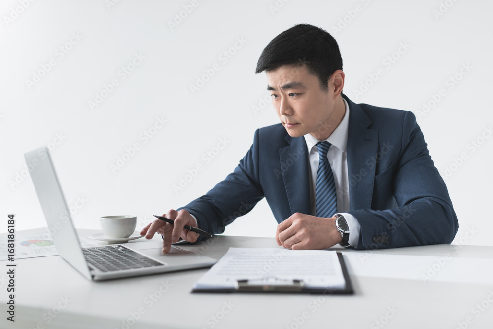 asian businessman with laptop at workplace asian businessman with laptop at workplace