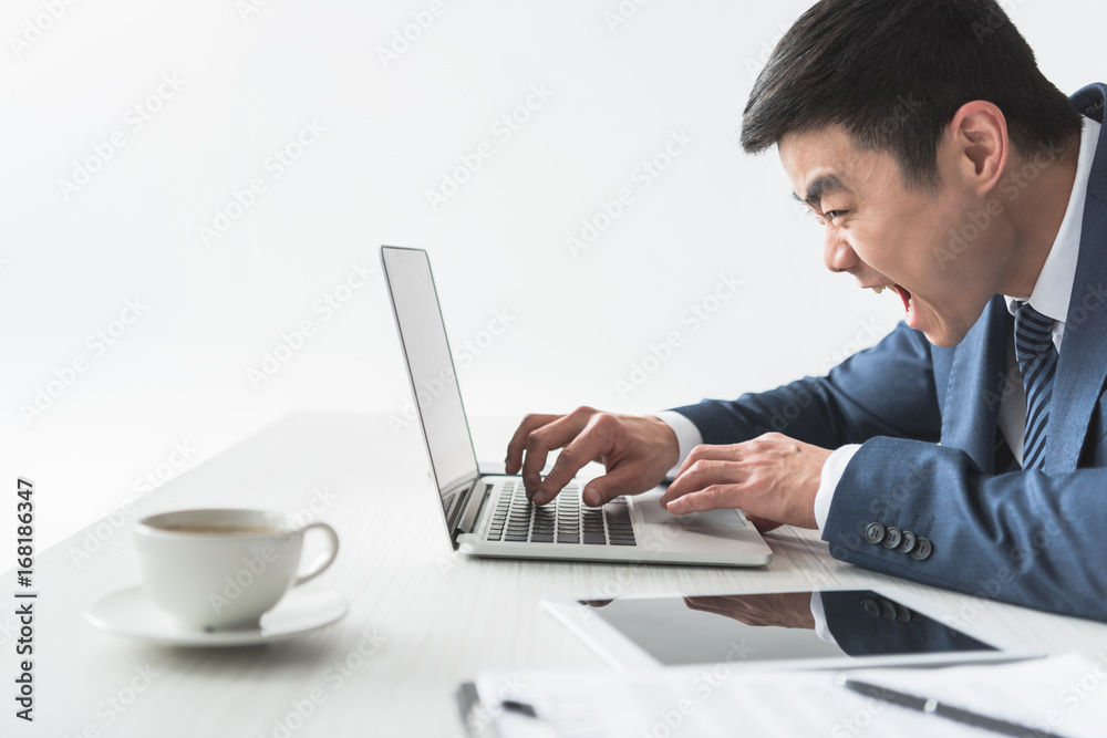 asian businessman typing on laptop asian businessman typing on laptop