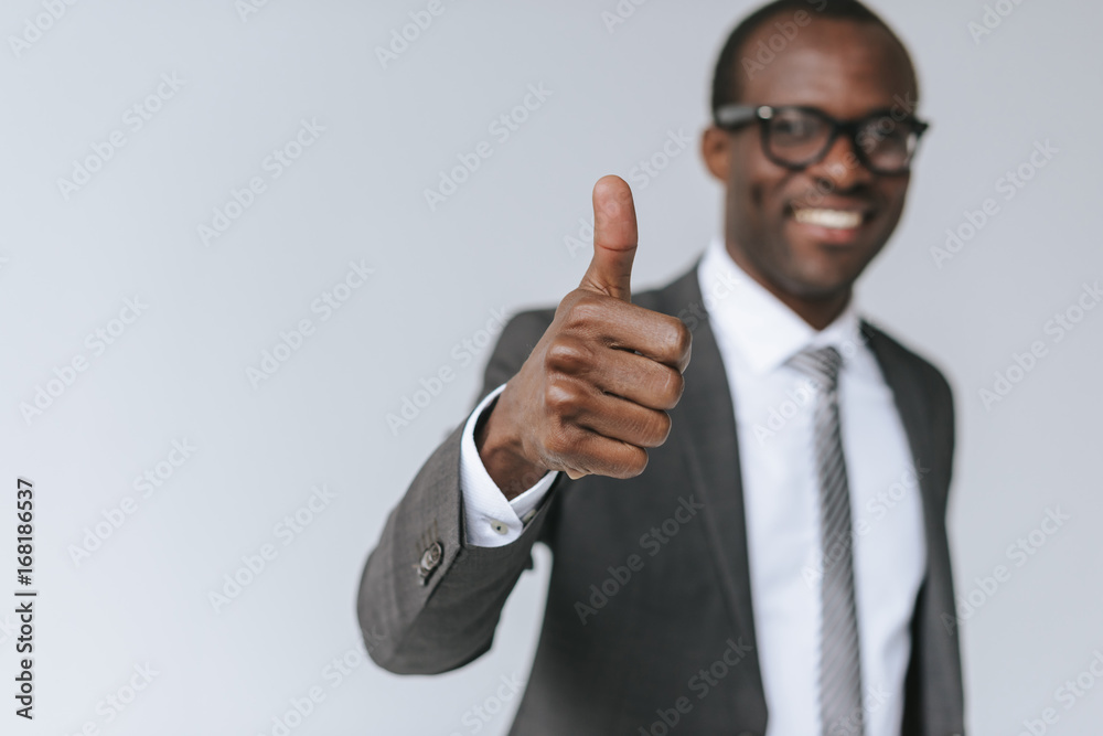 african american businessman showing thumb up african american businessman showing thumb up