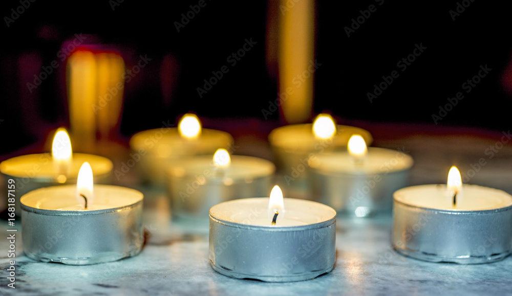 Tea candle, burning, solemn Tea candle, burning, solemn