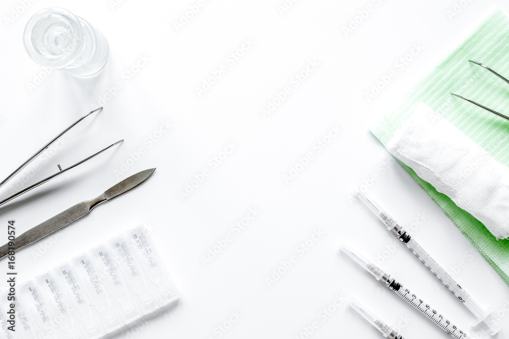 Naklejka premium instruments of gynecologist on white background top view mock up