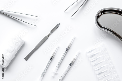 instruments of gynecologist on white background top view mock up