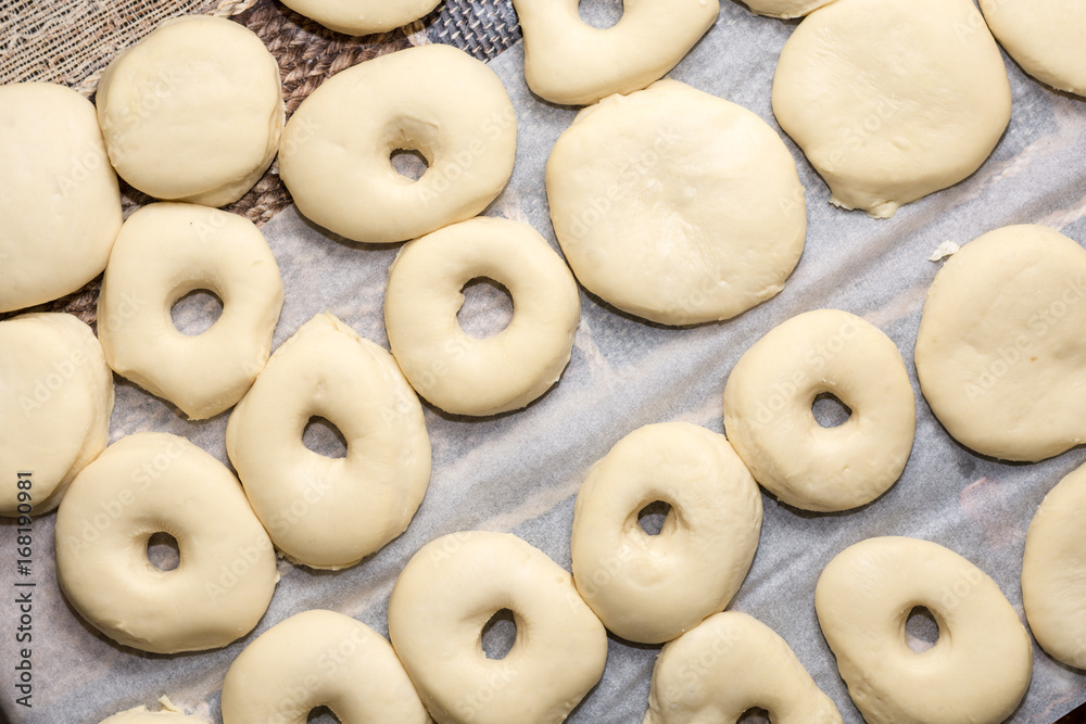 Flat lay above raw donuts dough ready for frying
