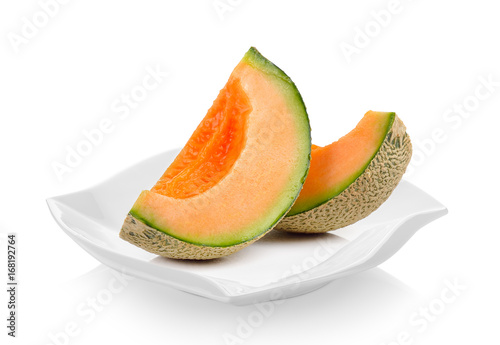 cantaloupe melon in ceramic plate on white background
