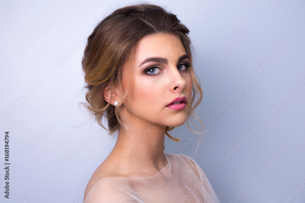 beautiful woman  bride with tiara on head  on bright background , copy space.