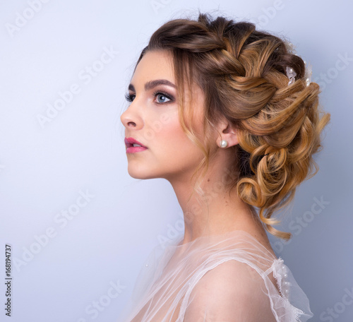 beautiful woman bride with tiara on head on bright background , copy space.