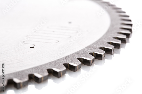 circular saws with teeth close-up, on a white