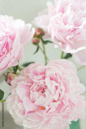 Bouquet of pink peonies in a vase. Bouquet of peonies in a vase on the table. Dressing table.