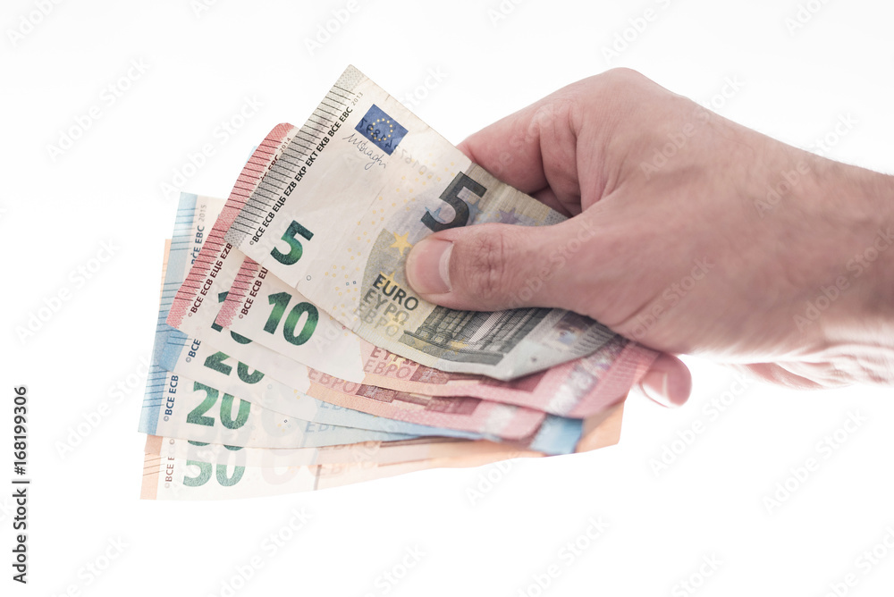 hand of male person handing over a couple of different euro bills