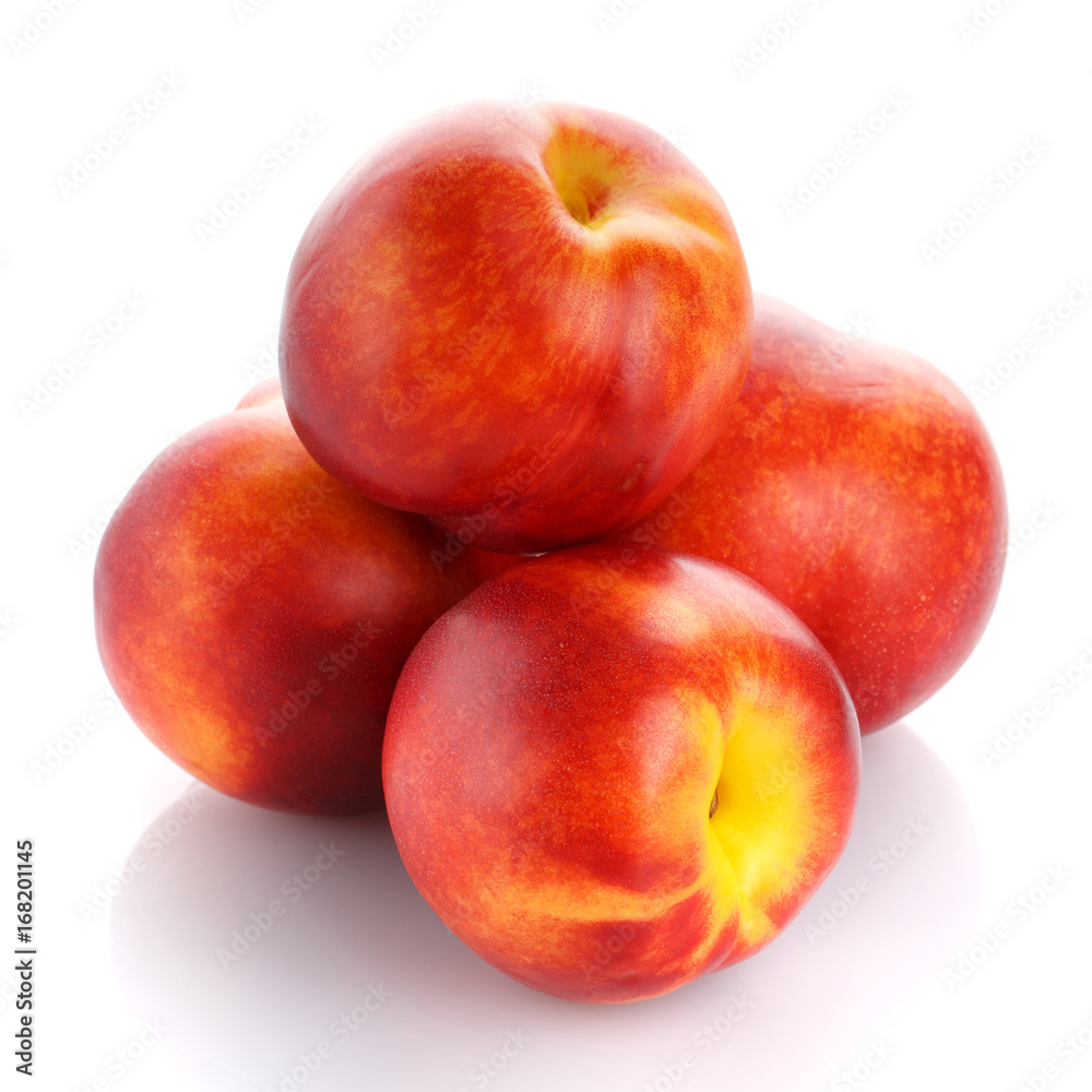 Ripe red peaches isolated on a white background. Ripe red peaches isolated on a white background.