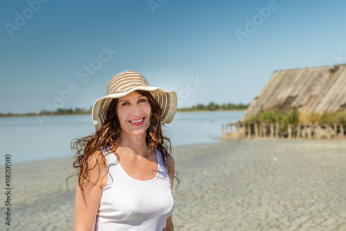 mature woman on sun split beach