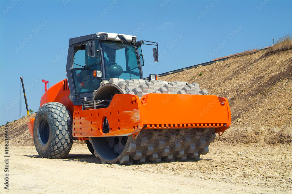 Soil compactor on construction site