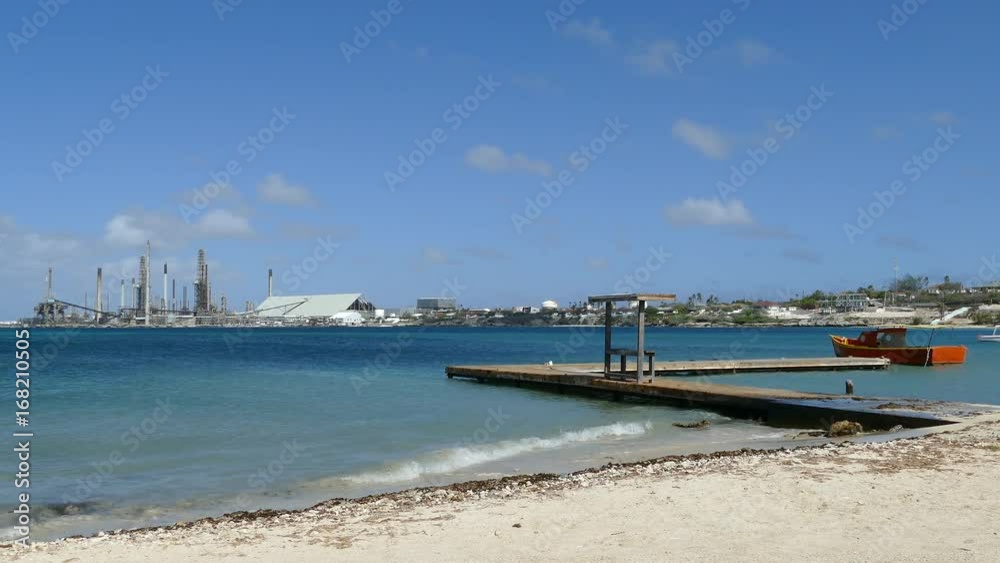 Rodgers beach with Valero Aruba Oil Refinery at the background Rodgers beach with Valero Aruba Oil Refinery at the background