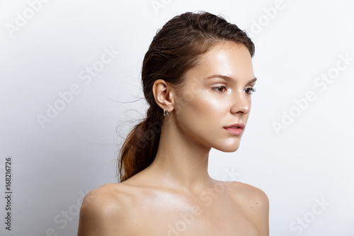 beautiful model woman with natural make-up and brunette hair studio fashion shot on white background