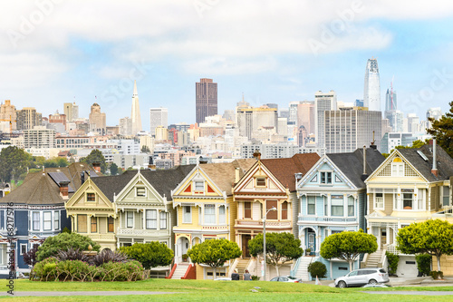 painted ladies and san francisco skyline at background view