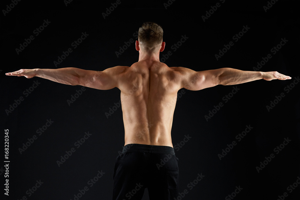 Naklejka premium young man or bodybuilder with bare torso