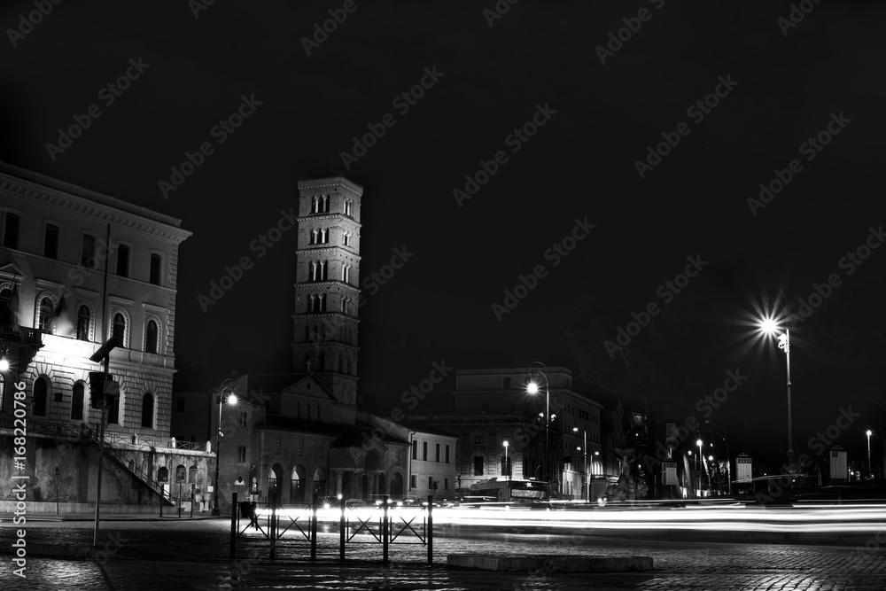 image of Rome by night, Saint Maria in Cosmedin, light trails cars