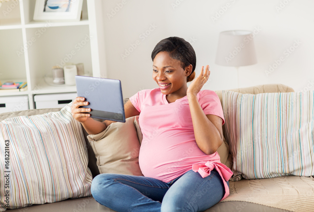 happy pregnant woman with tablet pc at home happy pregnant woman with tablet pc at home
