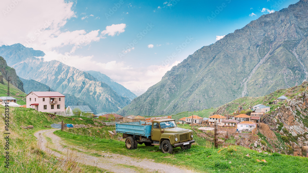 Georgia. Soviet Russian truck parking near village Tsdo in summer Georgia. Soviet Russian truck parking near village Tsdo in summer