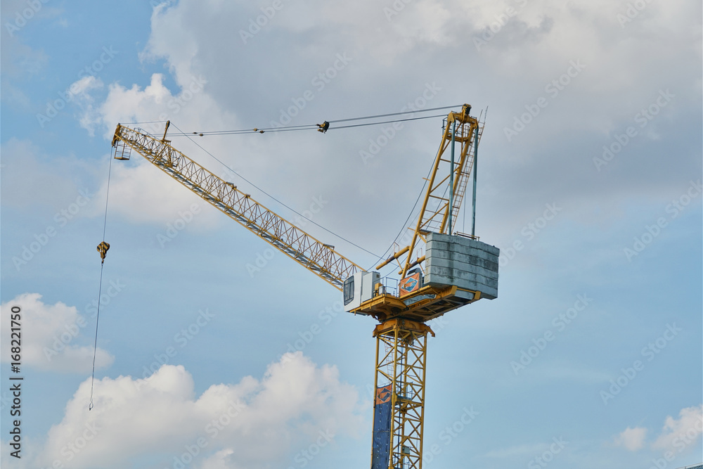 The yellow crane tower at construction sites. The yellow crane tower at construction sites.