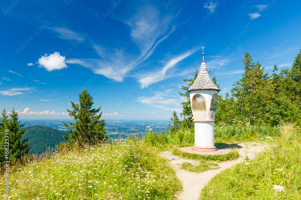 Summit cross of Mount Unternberg at Ruhpolding in summer Summit cross of Mount Unternberg at Ruhpolding in summer