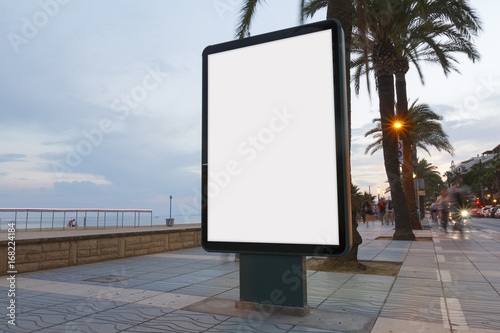 Blank billboard next to the beach