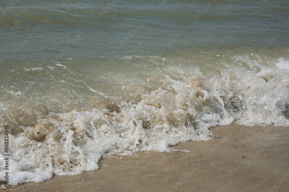 waves on the shore of the Sea of Azov beach. Waves run to the seashore.