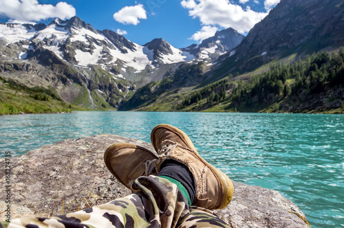 Man sitting with his legs straight stretch photo