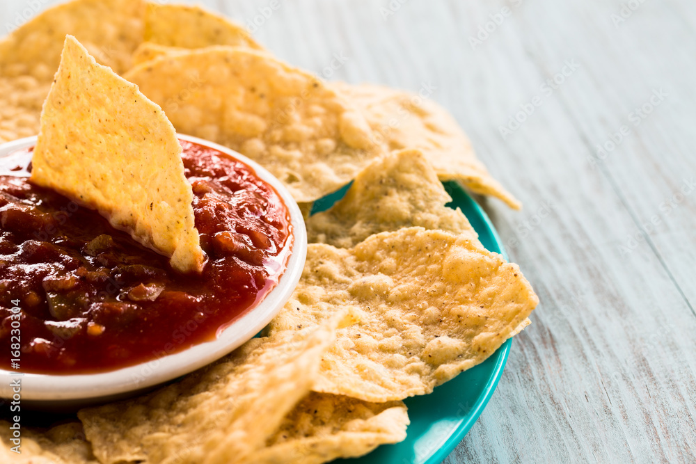 Bowl of Salsa With Tortilla Chips On Wooden Background Bowl of Salsa With Tortilla Chips On Wooden Background