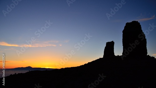 Vibrant sunset with intense blue sky, Roque Nublo and the frog, Canary islands