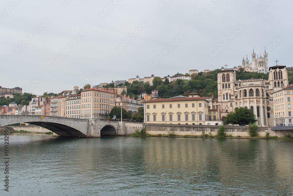 Vieux-Lyon, colorful houses and Bonaparte bridge in the center, on the river Saone
