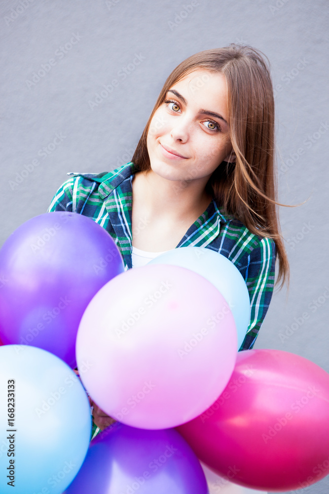 Beautiful teenage girl with freckles with balloons Beautiful teenage girl with freckles with balloons