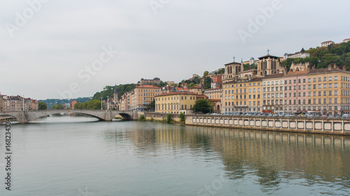 Vieux-Lyon, colorful houses and Bonaparte bridge in the center, on the river Saone   © Pascale Gueret