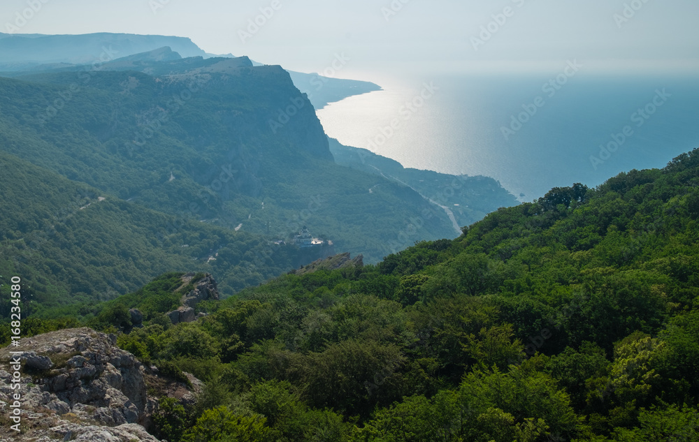 Mountain landscape. View of the sea and the green mountains in the Crimea.