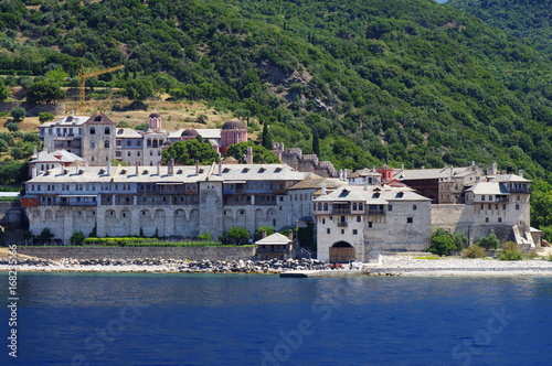 Athos peninsula, Greece. Xenofontos Monastery located in the Republic of Monks on the peninsula of Athos. View from a cruise ship . © wojtekmt