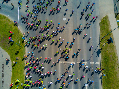 Aerial view of people running in the Riga Lattelecom marathon 2017 from the old town down to the center.