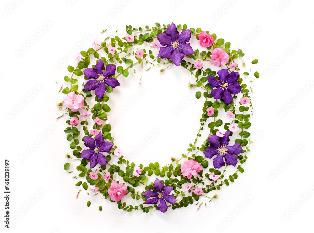 round floral frame with pink and purple flower buds, branches and leaves isolated on white background. flat lay, top view
